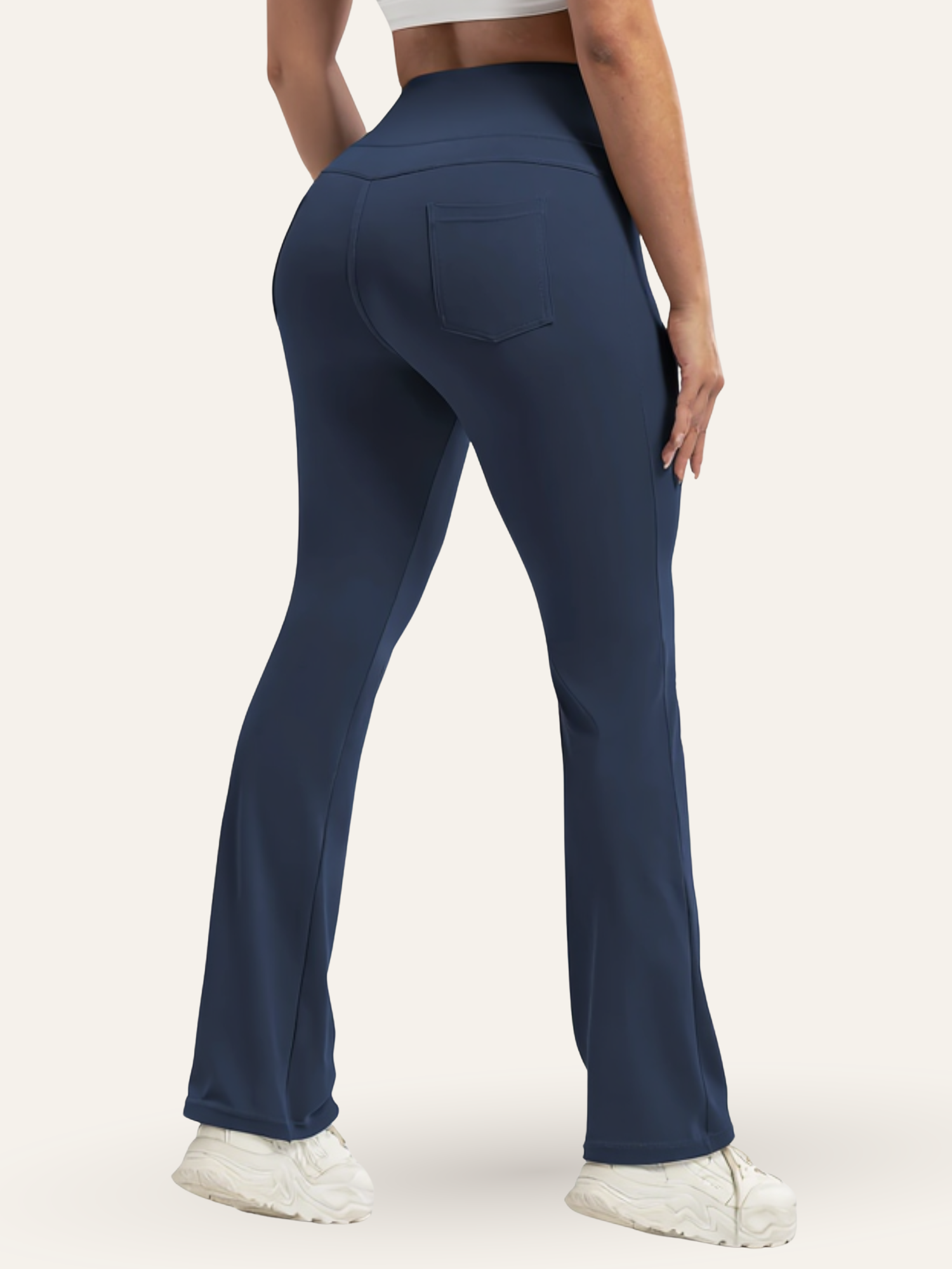 Navy blue leggings worn by a person on a white background